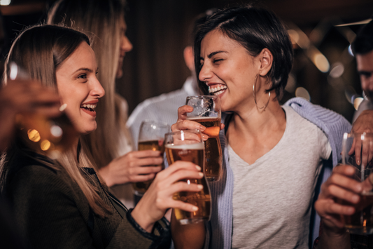 two women drinking beer